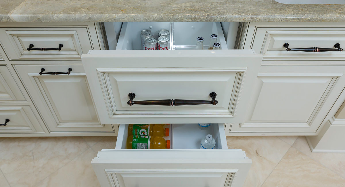 Off white painted full overlay cabinet drawers with raised panel drawer fronts