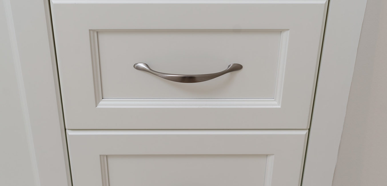 White bathroom vanity full overlay drawer stack with recessed panel doors