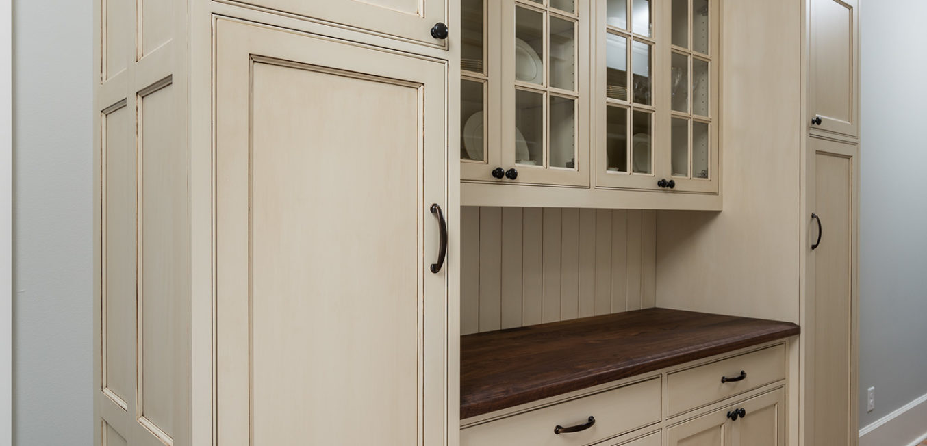 Light beige kitchen cupboard cabinet with inset shaker doors and Mullion decorative upper doors