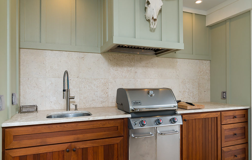 Stained outside grill with partial overlay cabinetry and shaker door fronts