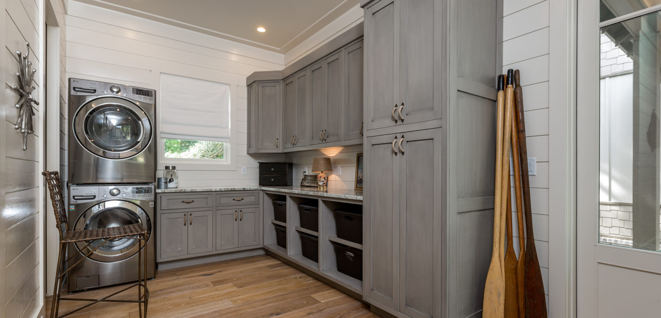 Gray Inset Laundry room cabinetry with shaker style doors