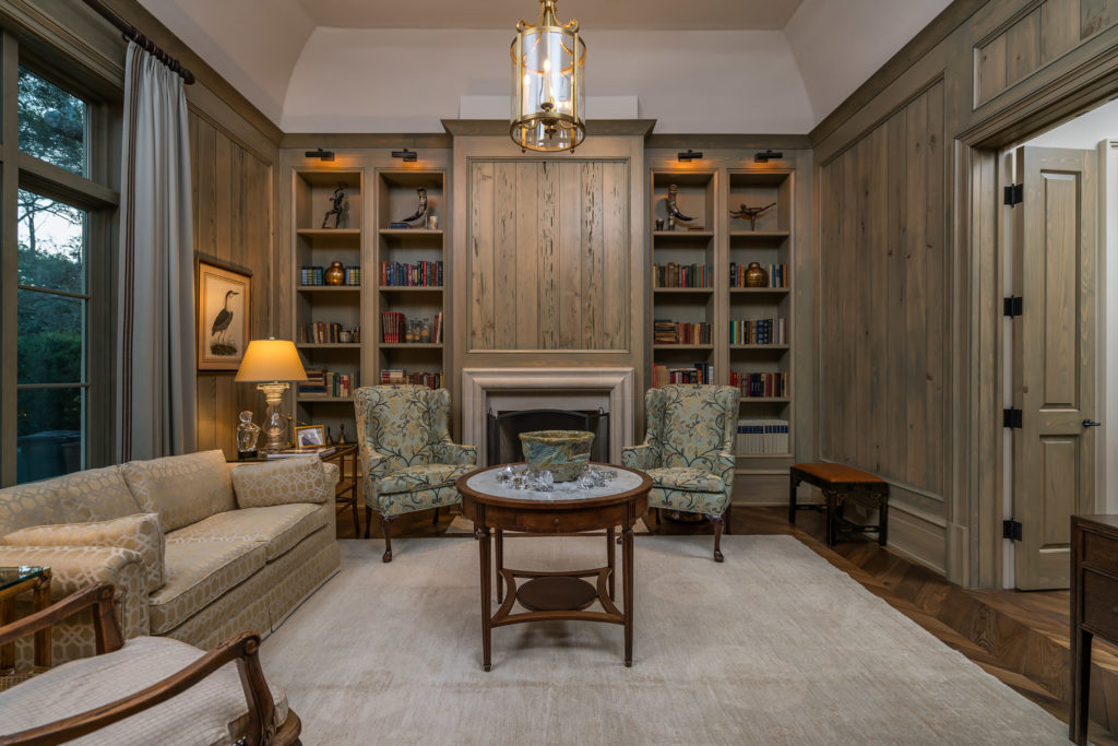 Blue Bell Home custom study built out of pecky cypress with a hidden bookshelf door