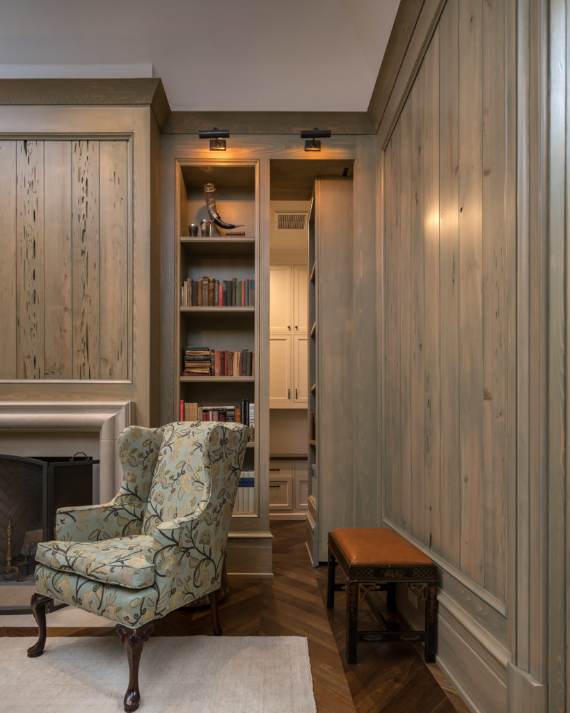 Blue Bell Home custom study built out of pecky cypress with a hidden bookshelf door
